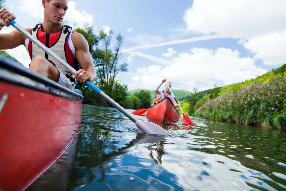 Canoeing down a river